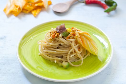 Spaghetti with marinated anchovy, zucchini and zucchini flowers