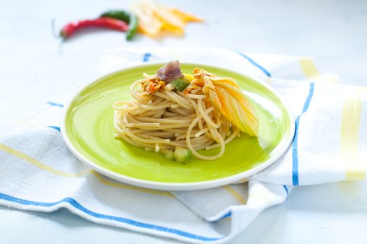 Spaghetti with marinated anchovy, zucchini and zucchini flowers