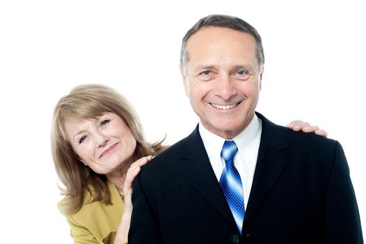 Attractive smiling senior couple over white