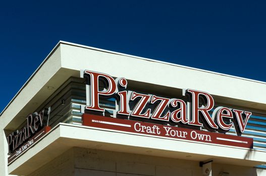BURBANK, CA/USA - SEPTEMBER 19, 2015: PizzaRev restaurant exterior and sign. PizzaRev is a fast casual chain of franchise pizza restaurants.