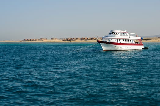 In the picture a yacht anchored near the port of Hamata , Egypt Red Sea