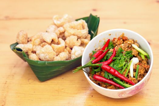 Thai Food appetizer ,Nam Prik Aong ,Thai Northern Style Pork and Tomato Relish and Pork snack, pork rind, pork scratching, pork crackling