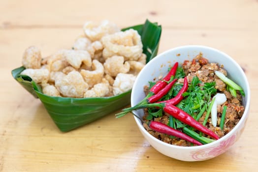 Thai Food appetizer ,Nam Prik Aong ,Thai Northern Style Pork and Tomato Relish and Pork snack, pork rind, pork scratching, pork crackling