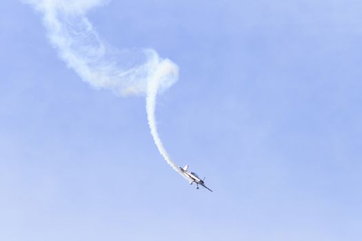 ENGLAND, Southport: A Xtreme Air XA-41 leaves a spiral smoke trail during the Southport Airshow 2015 in Southport, Merseyside in England on September 19, 2015