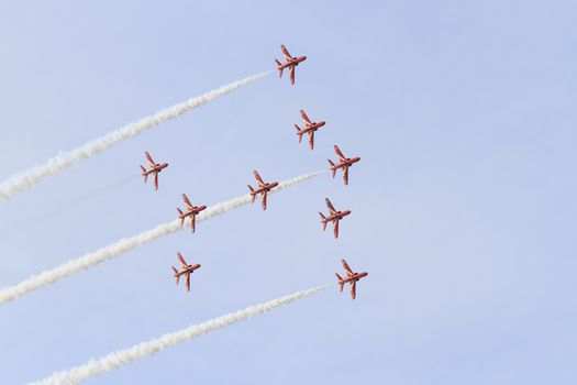 ENGLAND, Southport: Red Arrows fly in formation leaving smoke trails during the Southport Airshow 2015 in Southport, Merseyside in England on September 19, 2015