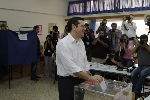 GREECE, Athens: Leader of left-wing party Syriza and former Prime minister Alexis Tsipras casts his ballot at his polling station in Athens on September 20, 2015 during Greek General Election first row. The election is the second Greek General Election within a year.
