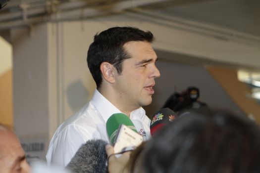 GREECE, Athens: Leader of left-wing party Syriza and former Prime minister Alexis Tsipras speaks to the press after casting his ballot at a polling station in Athens on September 20, 2015 during Greek General Election first row. The election is the second Greek General Election within a year.