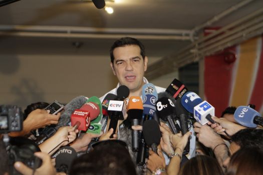 GREECE, Athens: Leader of left-wing party Syriza and former Prime minister Alexis Tsipras speaks to the press after casting his ballot at a polling station in Athens on September 20, 2015 during Greek General Election first row. The election is the second Greek General Election within a year.