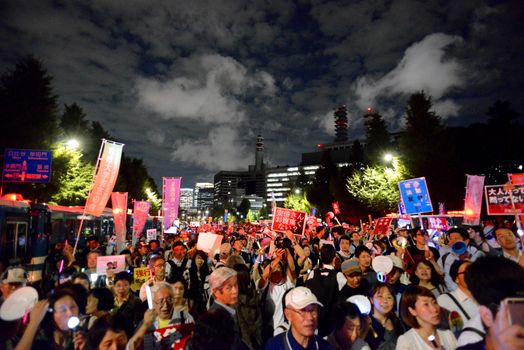 JAPAN, Tokyo: People gather near Japanese parliament in Tokyo, Japan, on September 14, 2015 during a demonstration against security law. Demonstrators claim Japanese Prime minister Shinzo Abe's resignation.