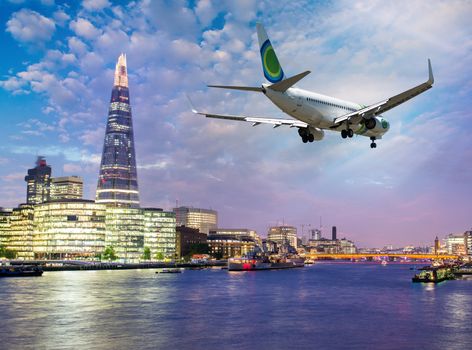 Airplane overflying London - Tourism and vacation concept.