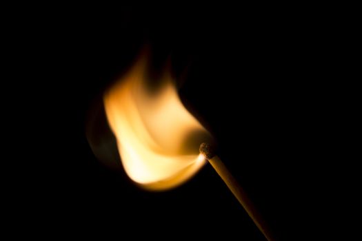 Match Igniting in a burst of fire. Macro Image.