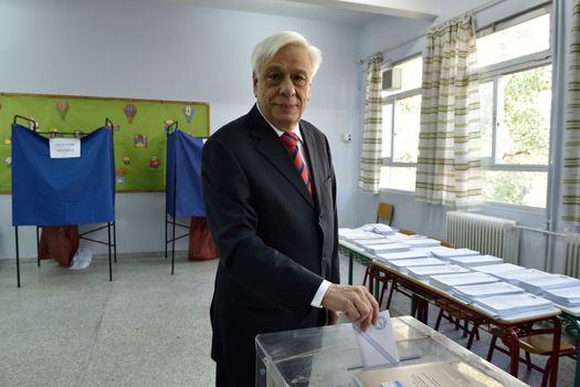 GREECE, Athens: Prokopis Pavlopoulos votes at the county's snap general elections in the Neo Psychiko region of Athens on September 20, 2015.  Greek voters head to the polls today in a tightly fought general election which is expected to be nail-bitingly close. 	 After just seven months of power, Alexis Tsipras called these snap elections to win a new mandate to implement Greece's new bailout plan. 