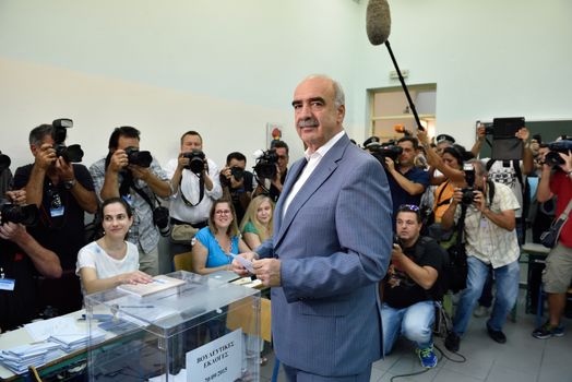 GREECE, Athens: Greece's main right-wing party, led by interim party chief Evangelos Meimarakis casts his vote at a polling station in Maroussi, Athens on September 20, 2015.  Greek voters head to the polls today in a tightly fought general election which is expected to be nail-bitingly close.  After just seven months of power, Alexis Tsipras called these snap elections to win a new mandate to implement Greece's new bailout plan. Meimarakis' party has been the main opposition party since losing power in January. 