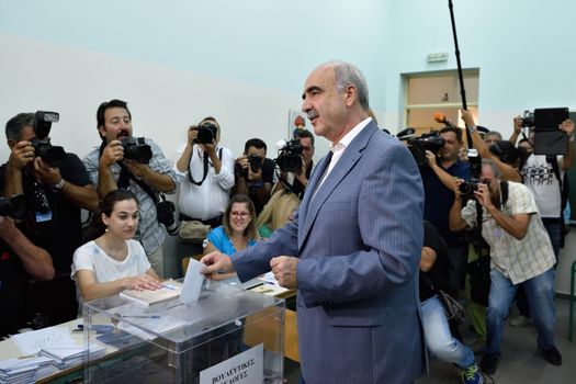 GREECE, Athens: Greece's main right-wing party, led by interim party chief Evangelos Meimarakis casts his vote at a polling station in Maroussi, Athens on September 20, 2015.  Greek voters head to the polls today in a tightly fought general election which is expected to be nail-bitingly close.  After just seven months of power, Alexis Tsipras called these snap elections to win a new mandate to implement Greece's new bailout plan. Meimarakis' party has been the main opposition party since losing power in January. 
