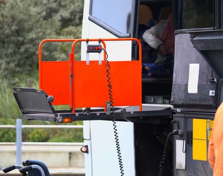 details of a bus using a chair lift for wheelchair