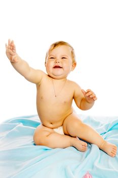 baby in diaper sitting on a blue blanket. Studio. Isolated