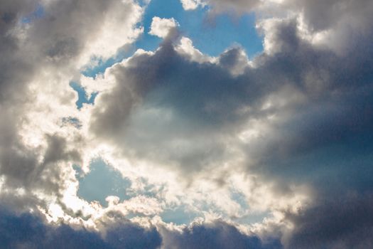 Dark clouds cover the blu sky