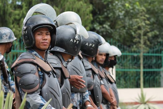 NEPAL, Kathmandu: A soldier smiles as Nepal celebrates a new constitution embracing the principles of republicanism, federalism, secularism, and inclusiveness, in Kathmandu on September 20, 2015. Out of the 598 members of the Constituent Assembly, 507 voted for the new constitution, 25 voted against, and 66 abstained in a vote on September 16, 2015. The event was marked with protests organized by parties of the Tharu and Madhesi ethnic communities, which according to Newzulu contributor Anish Gujarel led to violence in Southern Nepal.