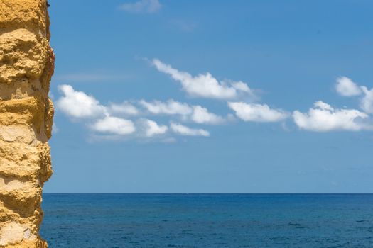 The sea with the stone wall. Copy space.