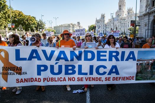 SPAIN, Madrid: Hundreds take to the streets of Madrid, Spain on September 20, 2015 as part of the White Tide movement to rally against health care privatization and budget cuts. 