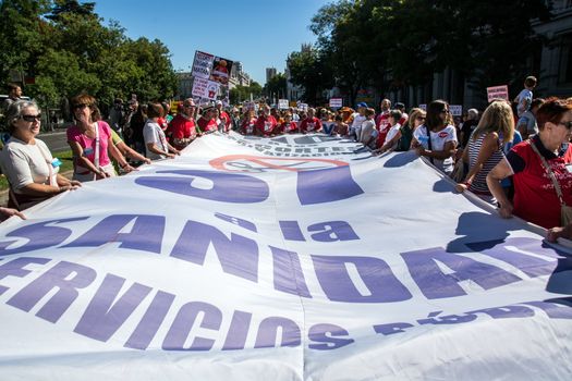 SPAIN, Madrid: Hundreds take to the streets of Madrid, Spain on September 20, 2015 as part of the White Tide movement to rally against health care privatization and budget cuts. 