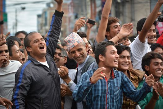 NEPAL, Kathmandu: After years of debate, Nepal adopted a new constitution on September 20, 2015, prompting scores of residents to celebrate near the constituent assembly building in Kathmandu. Out of the 598 members of the Constituent Assembly, 507 voted for the new constitution, 25 voted against, and 66 abstained in a vote on September 16, 2015. The event was marked with protests organized by parties of the Tharu and Madhesi ethnic communities, which according to Newzulu contributor Anish Gujarel led to violence in Southern Nepal.