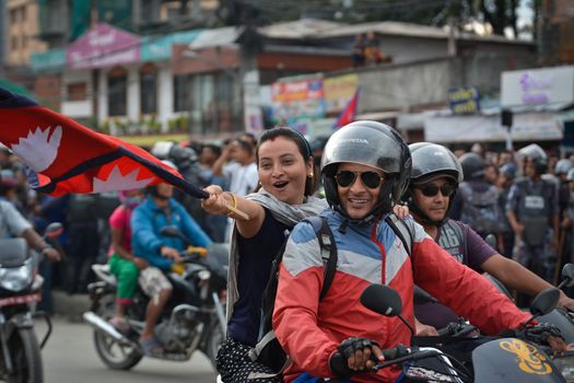 NEPAL, Kathmandu: After years of debate, Nepal adopted a new constitution on September 20, 2015, prompting scores of residents to celebrate near the constituent assembly building in Kathmandu. Out of the 598 members of the Constituent Assembly, 507 voted for the new constitution, 25 voted against, and 66 abstained in a vote on September 16, 2015. The event was marked with protests organized by parties of the Tharu and Madhesi ethnic communities, which according to Newzulu contributor Anish Gujarel led to violence in Southern Nepal.