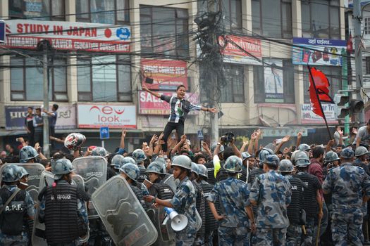 NEPAL, Kathmandu: After years of debate, Nepal adopted a new constitution on September 20, 2015, prompting scores of residents to celebrate near the constituent assembly building in Kathmandu. Out of the 598 members of the Constituent Assembly, 507 voted for the new constitution, 25 voted against, and 66 abstained in a vote on September 16, 2015. The event was marked with protests organized by parties of the Tharu and Madhesi ethnic communities, which according to Newzulu contributor Anish Gujarel led to violence in Southern Nepal.