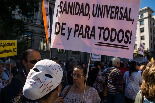 SPAIN, Madrid: Hundreds take to the streets of Madrid, Spain on September 20, 2015 as part of the White Tide movement to rally against health care privatization and budget cuts. 