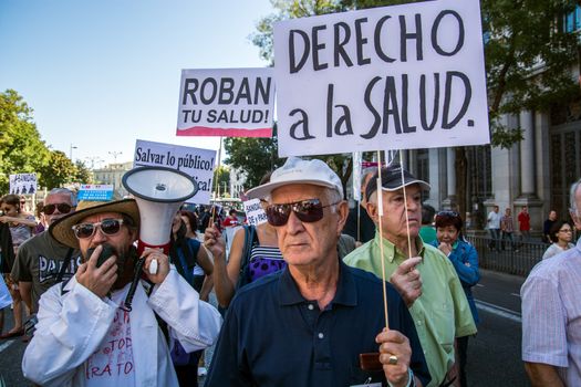 SPAIN, Madrid: Hundreds take to the streets of Madrid, Spain on September 20, 2015 as part of the White Tide movement to rally against health care privatization and budget cuts. 