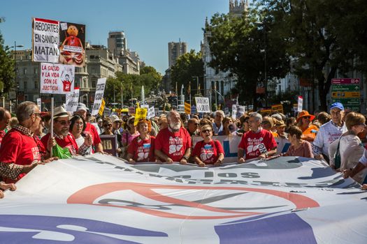 SPAIN, Madrid: Hundreds take to the streets of Madrid, Spain on September 20, 2015 as part of the White Tide movement to rally against health care privatization and budget cuts. 