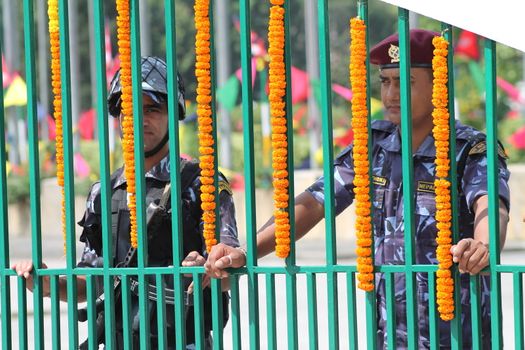 NEPAL, Kathmandu: Soldiers stand guard as Nepal celebrates a new constitution embracing the principles of republicanism, federalism, secularism, and inclusiveness, in Kathmandu on September 20, 2015. Out of the 598 members of the Constituent Assembly, 507 voted for the new constitution, 25 voted against, and 66 abstained in a vote on September 16, 2015. The event was marked with protests organized by parties of the Tharu and Madhesi ethnic communities, which according to Newzulu contributor Anish Gujarel led to violence in Southern Nepal.