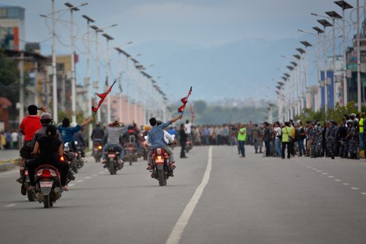 NEPAL, Kathmandu: After years of debate, Nepal adopted a new constitution on September 20, 2015, prompting scores of residents to celebrate near the constituent assembly building in Kathmandu. Out of the 598 members of the Constituent Assembly, 507 voted for the new constitution, 25 voted against, and 66 abstained in a vote on September 16, 2015. The event was marked with protests organized by parties of the Tharu and Madhesi ethnic communities, which according to Newzulu contributor Anish Gujarel led to violence in Southern Nepal.