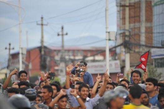 NEPAL, Kathmandu: After years of debate, Nepal adopted a new constitution on September 20, 2015, prompting scores of residents to celebrate near the constituent assembly building in Kathmandu. Out of the 598 members of the Constituent Assembly, 507 voted for the new constitution, 25 voted against, and 66 abstained in a vote on September 16, 2015. The event was marked with protests organized by parties of the Tharu and Madhesi ethnic communities, which according to Newzulu contributor Anish Gujarel led to violence in Southern Nepal.