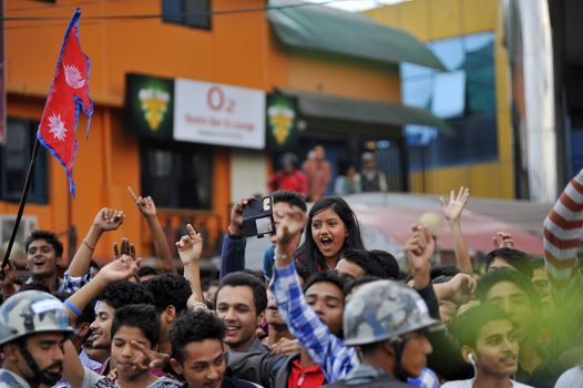 NEPAL, Kathmandu: After years of debate, Nepal adopted a new constitution on September 20, 2015, prompting scores of residents to celebrate near the constituent assembly building in Kathmandu. Out of the 598 members of the Constituent Assembly, 507 voted for the new constitution, 25 voted against, and 66 abstained in a vote on September 16, 2015. The event was marked with protests organized by parties of the Tharu and Madhesi ethnic communities, which according to Newzulu contributor Anish Gujarel led to violence in Southern Nepal.