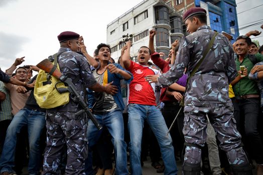 NEPAL, Kathmandu: After years of debate, Nepal adopted a new constitution on September 20, 2015, prompting scores of residents to celebrate near the constituent assembly building in Kathmandu. Out of the 598 members of the Constituent Assembly, 507 voted for the new constitution, 25 voted against, and 66 abstained in a vote on September 16, 2015. The event was marked with protests organized by parties of the Tharu and Madhesi ethnic communities, which according to Newzulu contributor Anish Gujarel led to violence in Southern Nepal.