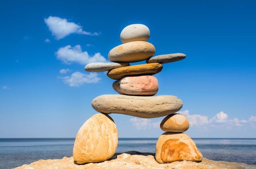 Symbol of Inukshuk on the seashore