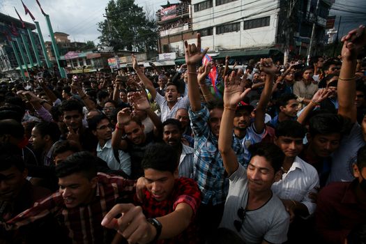 NEPAL, Kathmandu: After years of debate, Nepal adopted a new constitution on September 20, 2015, prompting scores of residents to celebrate near the constituent assembly building in Kathmandu. Out of the 598 members of the Constituent Assembly, 507 voted for the new constitution, 25 voted against, and 66 abstained in a vote on September 16, 2015. The event was marked with fireworks and fesitivities, but also with protests organized by parties of the Tharu and Madhesi ethnic communities.