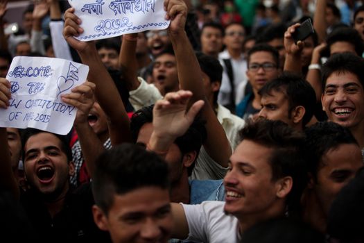 NEPAL, Kathmandu: After years of debate, Nepal adopted a new constitution on September 20, 2015, prompting scores of residents to celebrate near the constituent assembly building in Kathmandu. Out of the 598 members of the Constituent Assembly, 507 voted for the new constitution, 25 voted against, and 66 abstained in a vote on September 16, 2015. The event was marked with fireworks and fesitivities, but also with protests organized by parties of the Tharu and Madhesi ethnic communities.