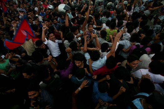 NEPAL, Kathmandu: After years of debate, Nepal adopted a new constitution on September 20, 2015, prompting scores of residents to celebrate near the constituent assembly building in Kathmandu. Out of the 598 members of the Constituent Assembly, 507 voted for the new constitution, 25 voted against, and 66 abstained in a vote on September 16, 2015. The event was marked with fireworks and fesitivities, but also with protests organized by parties of the Tharu and Madhesi ethnic communities.