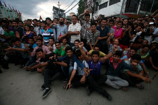 NEPAL, Kathmandu: After years of debate, Nepal adopted a new constitution on September 20, 2015, prompting scores of residents to celebrate near the constituent assembly building in Kathmandu. Out of the 598 members of the Constituent Assembly, 507 voted for the new constitution, 25 voted against, and 66 abstained in a vote on September 16, 2015. The event was marked with fireworks and fesitivities, but also with protests organized by parties of the Tharu and Madhesi ethnic communities.