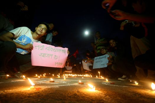 NEPAL, Kathmandu: After years of debate, Nepal adopted a new constitution on September 20, 2015, prompting scores of residents to celebrate near the constituent assembly building in Kathmandu. Out of the 598 members of the Constituent Assembly, 507 voted for the new constitution, 25 voted against, and 66 abstained in a vote on September 16, 2015. The event was marked with fireworks and fesitivities, but also with protests organized by parties of the Tharu and Madhesi ethnic communities.