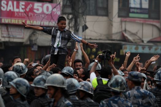 NEPAL, Kathmandu: After years of debate, Nepal adopted a new constitution on September 20, 2015, prompting scores of residents to celebrate near the constituent assembly building in Kathmandu. Out of the 598 members of the Constituent Assembly, 507 voted for the new constitution, 25 voted against, and 66 abstained in a vote on September 16, 2015. The event was marked with fireworks and fesitivities, but also with protests organized by parties of the Tharu and Madhesi ethnic communities.