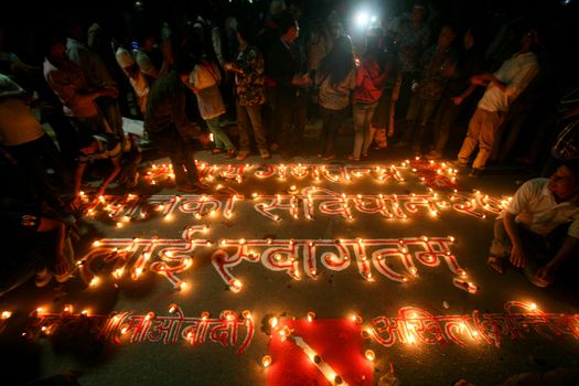 NEPAL, Kathmandu: After years of debate, Nepal adopted a new constitution on September 20, 2015, prompting scores of residents to celebrate near the constituent assembly building in Kathmandu. Out of the 598 members of the Constituent Assembly, 507 voted for the new constitution, 25 voted against, and 66 abstained in a vote on September 16, 2015. The event was marked with fireworks and fesitivities, but also with protests organized by parties of the Tharu and Madhesi ethnic communities.