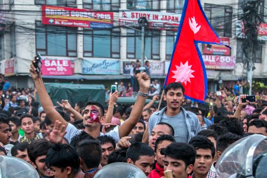 NEPAL, Kathmandu: After years of debate, Nepal adopted a new constitution on September 20, 2015, prompting scores of residents to celebrate near the constituent assembly building in Kathmandu. Out of the 598 members of the Constituent Assembly, 507 voted for the new constitution, 25 voted against, and 66 abstained in a vote on September 16, 2015. The event was marked with fireworks and festivities, but also with protests organized by parties of the Tharu and Madhesi ethnic communities.