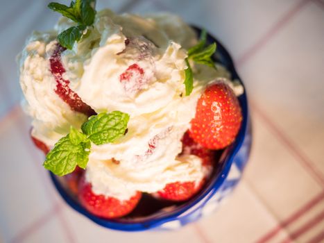 Strawberry wuth whipped cream in traditional russian plate - gzhel