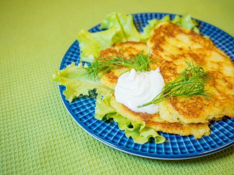 potato pankakes with cream frache and dill - draniki