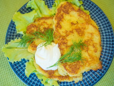 potato pankakes with cream frache and dill - draniki