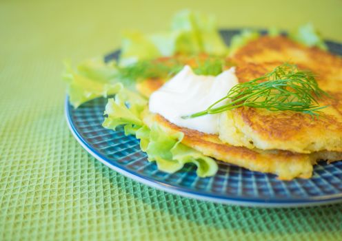 potato pankakes with cream frache and dill - draniki