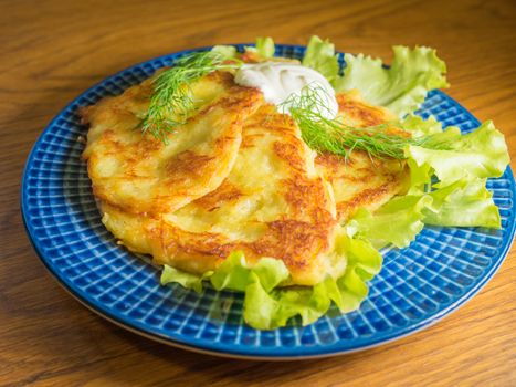 potato pankakes with cream frache and dill - draniki